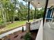 Side porch with stone accents and a view of the yard at 1350 Geneva Albright Rd, Graham, NC 27253