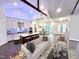 Open living area, featuring a white couch and kitchen view at 1350 Geneva Albright Rd, Graham, NC 27253
