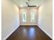 Simple bedroom with hardwood floors and large windows at 1350 Geneva Albright Rd, Graham, NC 27253