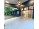 Covered back porch with ceiling fan and access to the home's interior at 1350 Geneva Albright Rd, Graham, NC 27253