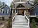 Front entry with white staircase and stone accents at 1350 Geneva Albright Rd, Graham, NC 27253