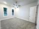 Bright bedroom with neutral carpet and ceiling fan at 1350 Geneva Albright Rd, Graham, NC 27253