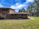 Brick ranch-style home with a spacious lawn and mature trees at 130 S Estes Dr # B7, Chapel Hill, NC 27514