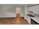 Kitchen with white cabinets, stainless steel appliances, and wood-look floors at 130 S Estes Dr # B7, Chapel Hill, NC 27514