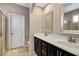 Elegant bathroom with double vanity, and a large mirror at 813 Wildflower Ridge Rd, Wake Forest, NC 27587