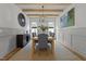 Formal dining room with chandelier, hardwood floors, and built-in shelving at 5305 Dixon Dr, Raleigh, NC 27609
