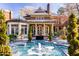 House with a fountain and patio, showcasing its outdoor living space at 2441 W Lake Dr, Raleigh, NC 27609