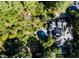 Aerial view of a house and lush gardens, showcasing expansive landscaping at 2441 W Lake Dr, Raleigh, NC 27609