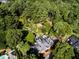 Aerial view of the house and surrounding landscape, highlighting its private setting at 2441 W Lake Dr, Raleigh, NC 27609