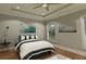 Spacious bedroom with hardwood floors and ceiling fan at 2709 Fayetteville St # 01-A, Durham, NC 27707