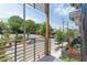 Balcony overlooking a tree-lined street with parking at 521 N Mangum St # 21, Durham, NC 27701