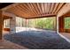 Unfinished basement with large windows offering natural light and view of wooded area at 1805 Okeefe Ln # 1D, Raleigh, NC 27613