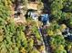 Aerial view of two homes under construction on a wooded lot at 1805 Okeefe Ln # 1D, Raleigh, NC 27613