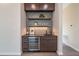 Built-in wet bar with wine cooler, shelving, and mosaic tile backsplash at 31 Meandering Way Ct, Chapel Hill, NC 27516
