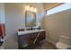 Stylish bathroom with floating vanity, modern fixtures and a toilet at 31 Meandering Way Ct, Chapel Hill, NC 27516