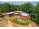 Contemporary home nestled in a wooded lot with a landscaped yard at 31 Meandering Way Ct, Chapel Hill, NC 27516