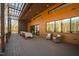 Spacious deck with pergola, dining table, and rocking chairs, overlooking wooded area at 31 Meandering Way Ct, Chapel Hill, NC 27516