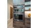 Built-in KitchenAid double oven and microwave in a modern kitchen setting at 31 Meandering Way Ct, Chapel Hill, NC 27516