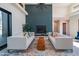 Living room with modern fireplace, comfortable seating and large windows at 31 Meandering Way Ct, Chapel Hill, NC 27516