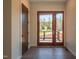 Hallway with wood door and access to a deck overlooking the backyard at 31 Meandering Way Ct, Chapel Hill, NC 27516