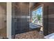 Sleek bathroom with walk-in shower and pebble floor at 31 Meandering Way Ct, Chapel Hill, NC 27516