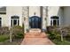 Elegant front entrance with black wrought-iron double doors and stone columns at 40002 Worth, Chapel Hill, NC 27517
