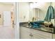 Powder room with blue glass sink, granite countertop, and white cabinets at 40002 Worth, Chapel Hill, NC 27517