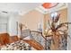 Elegant upper hallway with hardwood floors and a curved staircase at 40002 Worth, Chapel Hill, NC 27517