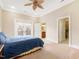 Spacious bedroom with plush carpet, private balcony, and ensuite bathroom at 40002 Worth, Chapel Hill, NC 27517