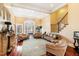 Spacious living room with hardwood floors, leather sofas, and a fireplace at 40002 Worth, Chapel Hill, NC 27517