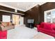 Sitting room with red and beige sofas and large windows at 40002 Worth, Chapel Hill, NC 27517