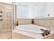 Relaxing bathroom featuring a corner jacuzzi tub and shower at 40002 Worth, Chapel Hill, NC 27517