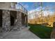 Landscaped backyard with stone retaining wall and trees at 40002 Worth, Chapel Hill, NC 27517