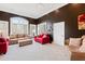 Sitting room with red and beige sofas and large windows at 40002 Worth, Chapel Hill, NC 27517