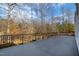 Large deck with black railing overlooking a wooded area at 40002 Worth, Chapel Hill, NC 27517