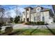 Exterior of a large two-story home with stone accents and a circular driveway at 40002 Worth, Chapel Hill, NC 27517