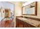 Small bathroom with granite countertop and a mirror at 40002 Worth, Chapel Hill, NC 27517