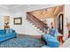 Elegant living room features a grand staircase, hardwood floors, and comfortable seating at 40002 Worth, Chapel Hill, NC 27517