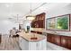 Large kitchen with granite island, copper sink, and breakfast area at 40002 Worth, Chapel Hill, NC 27517