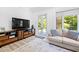 Sitting room with hardwood floors, large TV, and comfortable seating at 40002 Worth, Chapel Hill, NC 27517