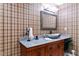 Bathroom with granite countertop, vessel sink, and plaid wallpaper at 40002 Worth, Chapel Hill, NC 27517