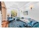 Bright living room with large windows, hardwood floors, and plush seating at 40002 Worth, Chapel Hill, NC 27517