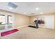 Basement home gym with treadmill and access to backyard at 40002 Worth, Chapel Hill, NC 27517