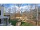 Spacious backyard with stone retaining wall and wooded area at 40002 Worth, Chapel Hill, NC 27517