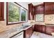 Spacious kitchen with granite countertops, dark wood cabinets, and stainless steel appliances at 40002 Worth, Chapel Hill, NC 27517