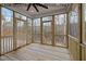 Spacious screened porch with wooden flooring and access to a deck at 610 Sherron Rd, Durham, NC 27703