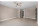 Well-lit bedroom with wood-look floors and access to a bathroom at 4268 Jacks Creek Trl, Burlington, NC 27215