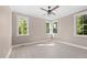 Bright bedroom with hardwood floors and multiple windows at 4268 Jacks Creek Trl, Burlington, NC 27215