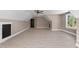 Bonus room with high ceiling, wood-look floors, and window at 4268 Jacks Creek Trl, Burlington, NC 27215