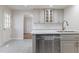 Modern kitchen with white cabinets, stainless steel appliances, and tile floors at 904 Grove St, Chapel Hill, NC 27517
